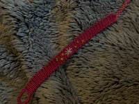 Image 1 of embroidered daisy bracelet