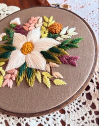 Image 3 of 6” White floral embroidery with green leaves on brown fabric 