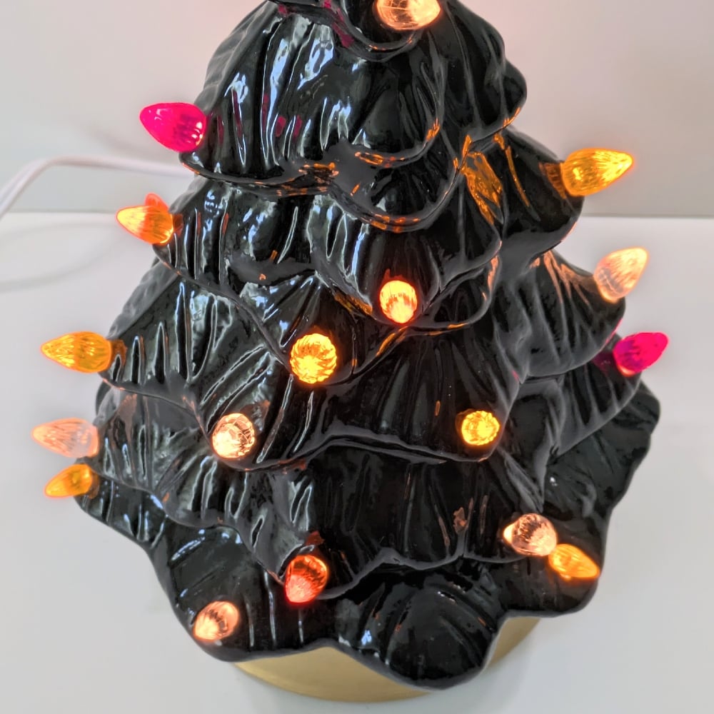 Image of Black Ceramic Lighted Halloween Tree With Gold Base and Various Ornaments