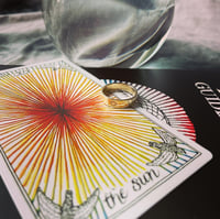 Image 2 of Celestial 9ct gold wedding ring with sun stamp detail. Cosmic sun gold wedding band stamped