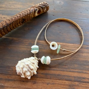 Image of Hawaiian Ivory Drupe Shell Necklace with Puka Shells, Teal Seaglass (22 inch)