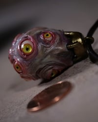 Image 5 of Egg of the King pendant, leather cord, brass hardware, all seeing glowing eyes