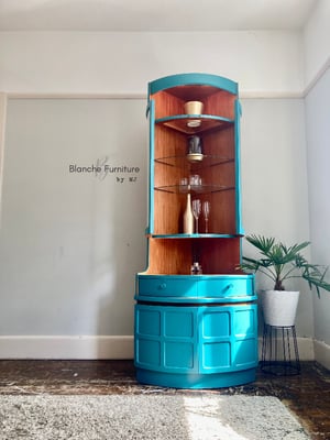 Image of Nathan Corner Drinks Cabinet unit with light in vibrant teal