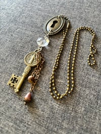 Image 1 of Steampunk repurposed necklace with key hole and religious key