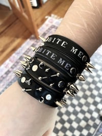 Image 3 of bite me and pierced leather cuffs