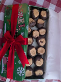 Image 1 of 15 count buckeyes in a Christmas tin