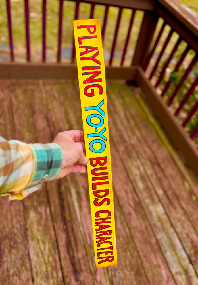Image of Playing Yo-Yo Builds Character Wood Sign