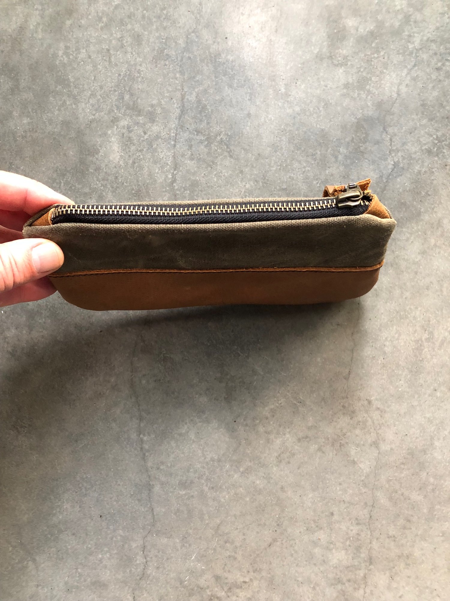 Image of pencil case made from field tan waxed canvas and oiled leather