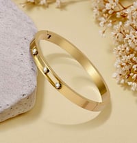 Image 1 of Her Signature, 14K Gold LOVe. Bangle Bracelet for women by Y. Cashay