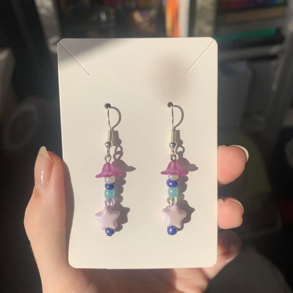 Image of purple star earrings