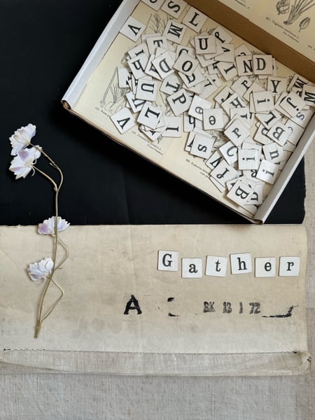 Image of Word making vintage letter tiles in decorative box