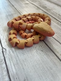 Image 1 of Orange/pink Articulated Snake