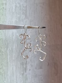 Image 2 of hanging ornament earrings 