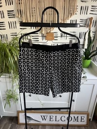 Image 1 of white and black shorts 