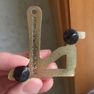 Image of 2” Brass 75th Anniv. Tahiti Felix Jonesy Pin