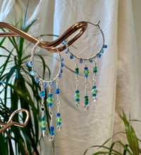 Image 1 of silver hoops in green/blue