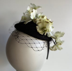 Image of Black felt button trimmed with flowers