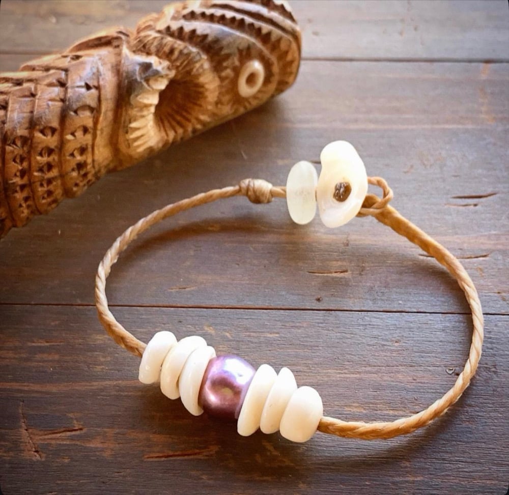 Image of Edison pearl and puka shells bracelet with locking seaglass clasp on hand braided sinew