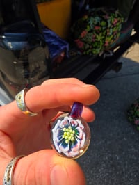 Image 2 of Fully uv reactive flower pendant. 