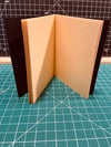 Softcover journal with teal and gold cover