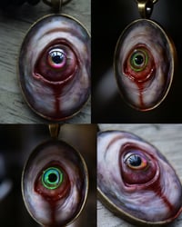 Image 1 of Color Shift Eye glow in the dark pendant OOAK
