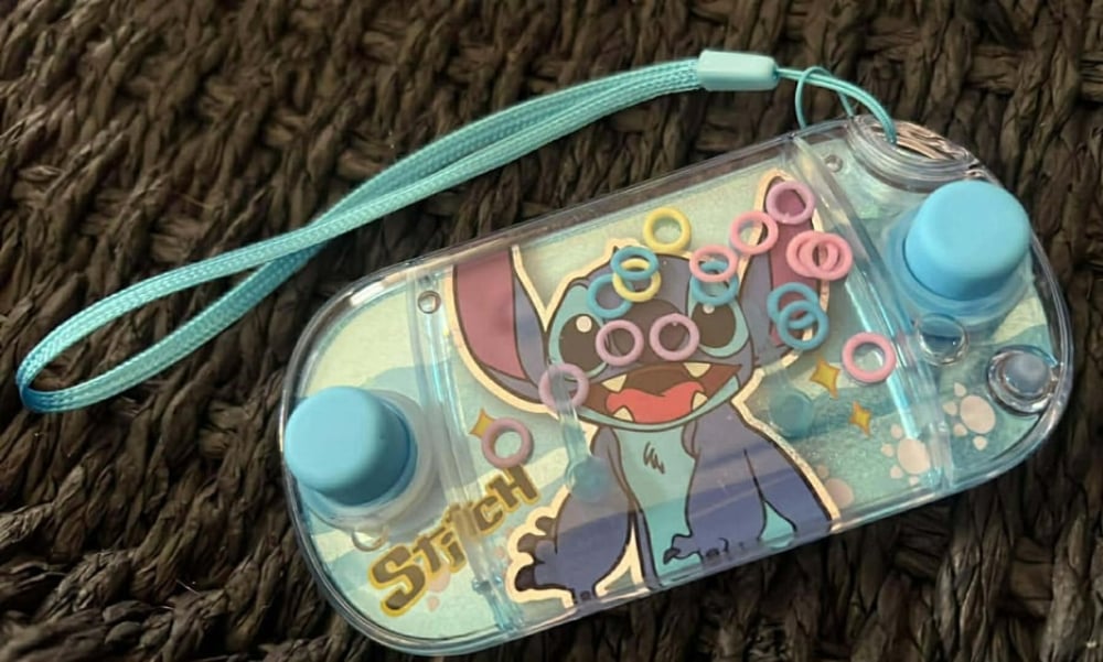 Image of Blue Stitch Handheld Watergame W/ Wristlet 