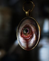 Image 2 of Color Shift Eye glow in the dark pendant OOAK