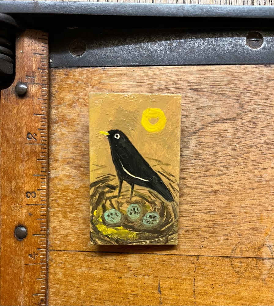 Image of Blackbird in a nest brooch 