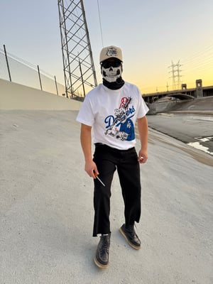 Image of bleed blue T