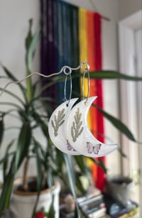 Image 3 of milky butterfly hoops
