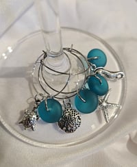 Image 2 of lagoon teal seaglass wine charms