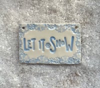 Image 1 of Let it Snow ceramic tile decoration. 