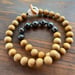Image of Tahitian pearl necklace with sandalwood beads and a tiger puka shell clasp