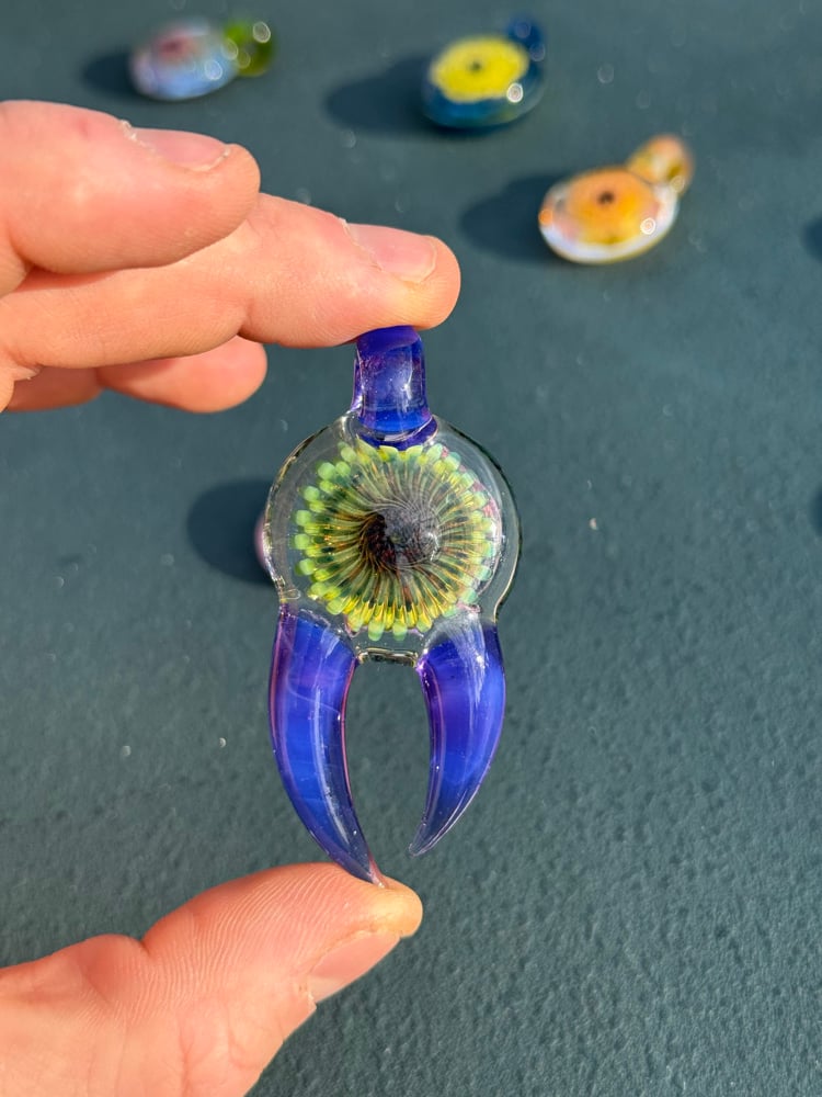 Image of  Green and purple horned pendant