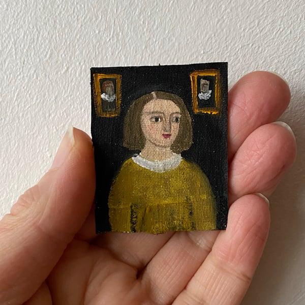 Image of young girl in gold - very tiny portrait 