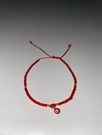 Image 1 of Red/gold dangle evil eye bracelet 