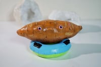 Image 2 of Sweet Potato on a Pool Floatie