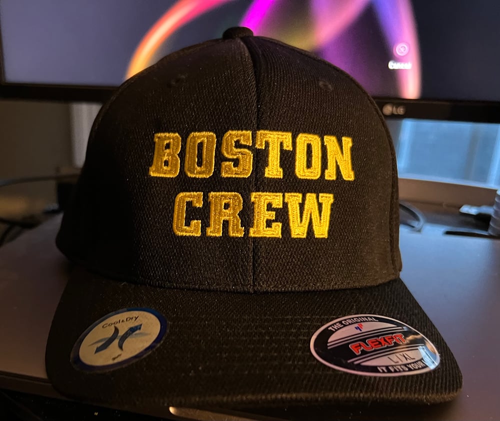 Black Flexfit hat with yellow “Boston Crew" Logo