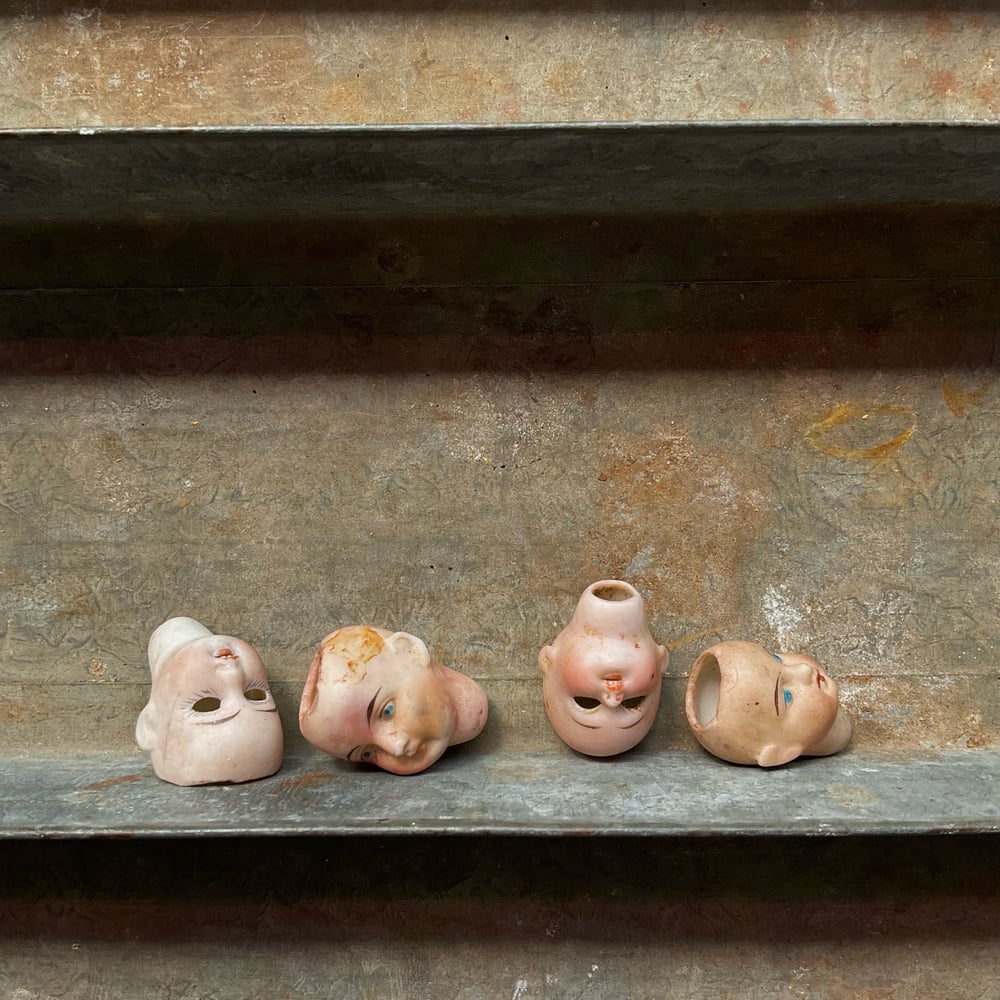 Image of Four Tiny Doll Heads