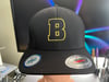 Berthold City Bold Gold Boston B Outline Black Flexfit Baseball Hat
