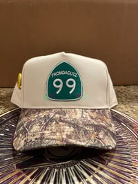 Image 1 of 99 Cream/Camo snap Back 