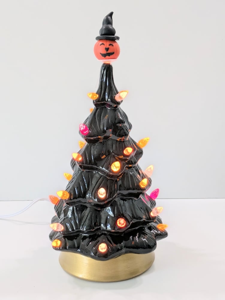 Image of Black Ceramic Lighted Halloween Tree With Gold Base and Various Ornaments