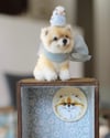 Pipe cleaner miniature Pom puppy with its magnetic wooden display