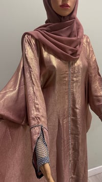 Image 6 of Korean shimmer fabric Flared sleeve abaya rose gold it comes with a matching scarf 