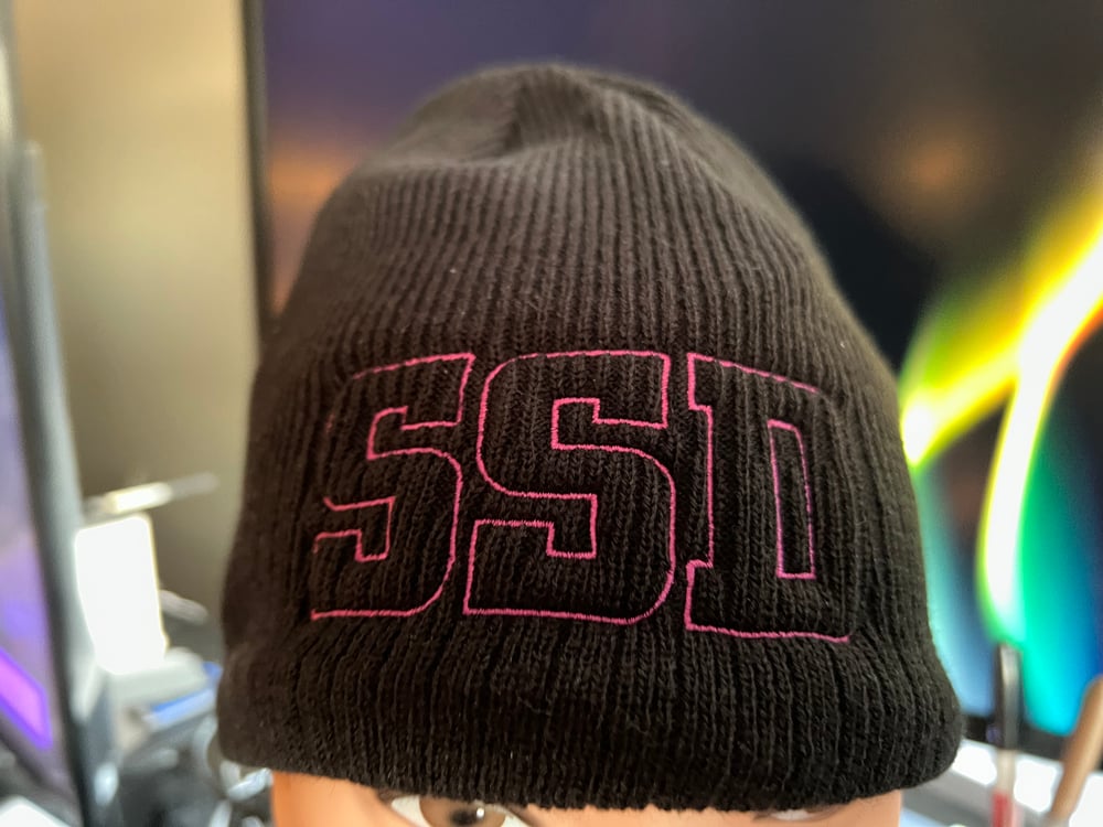 Black New Era Knit beanie hat with Magenta SSD Outline logo 