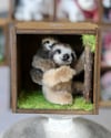 Pipe cleaner miniature sloths with their magnetic wooden display 