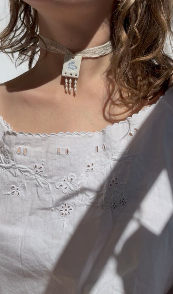 Image of porcelain and pearls pendants