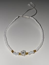 Image 2 of White flower evil eye bracelet 