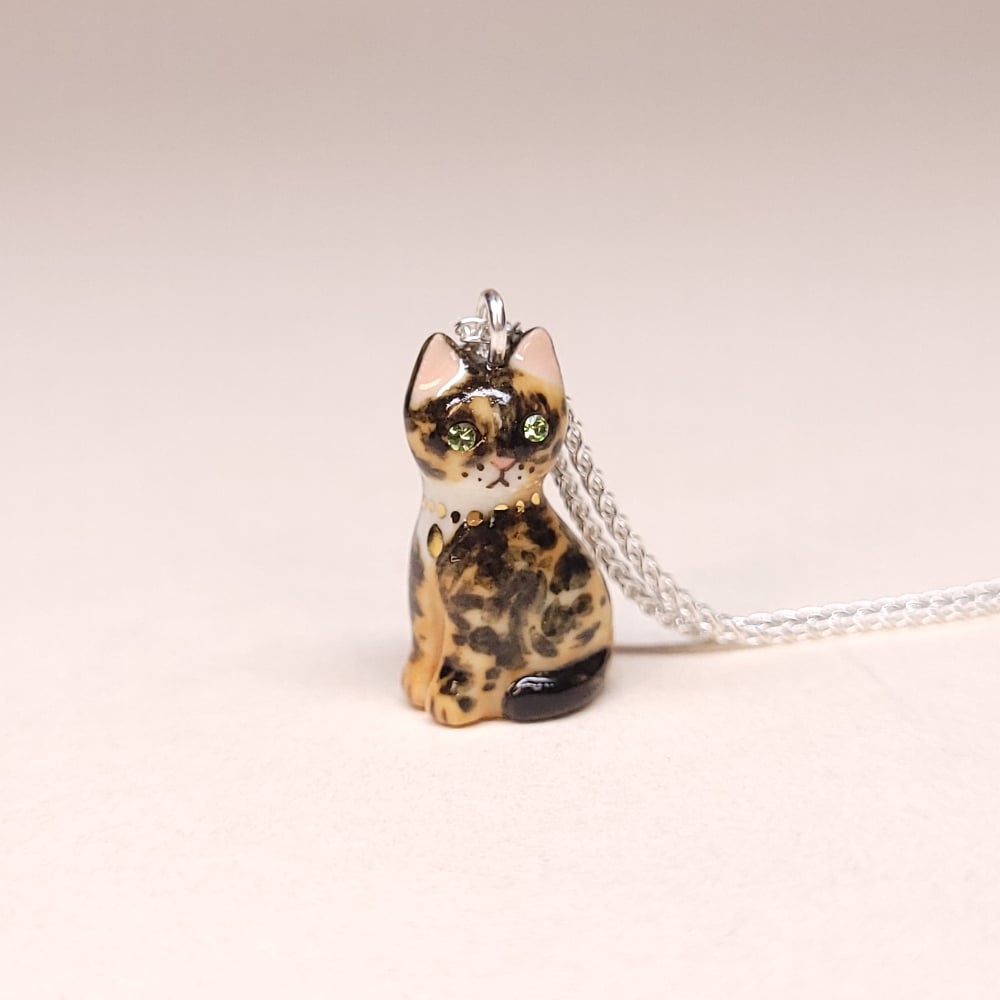 Image of Tortoiseshell Porcelain & Sterling Silver Sitting Kitten Pendant