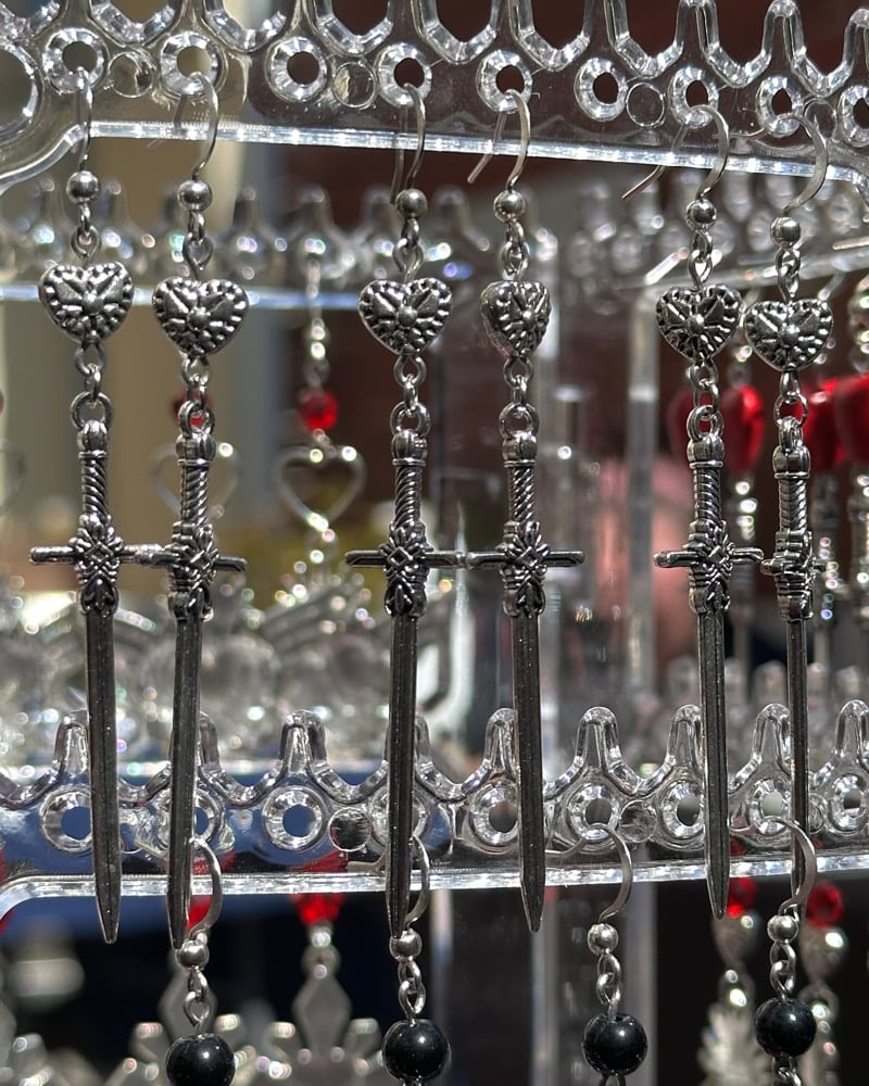 Image of silver sword dangles